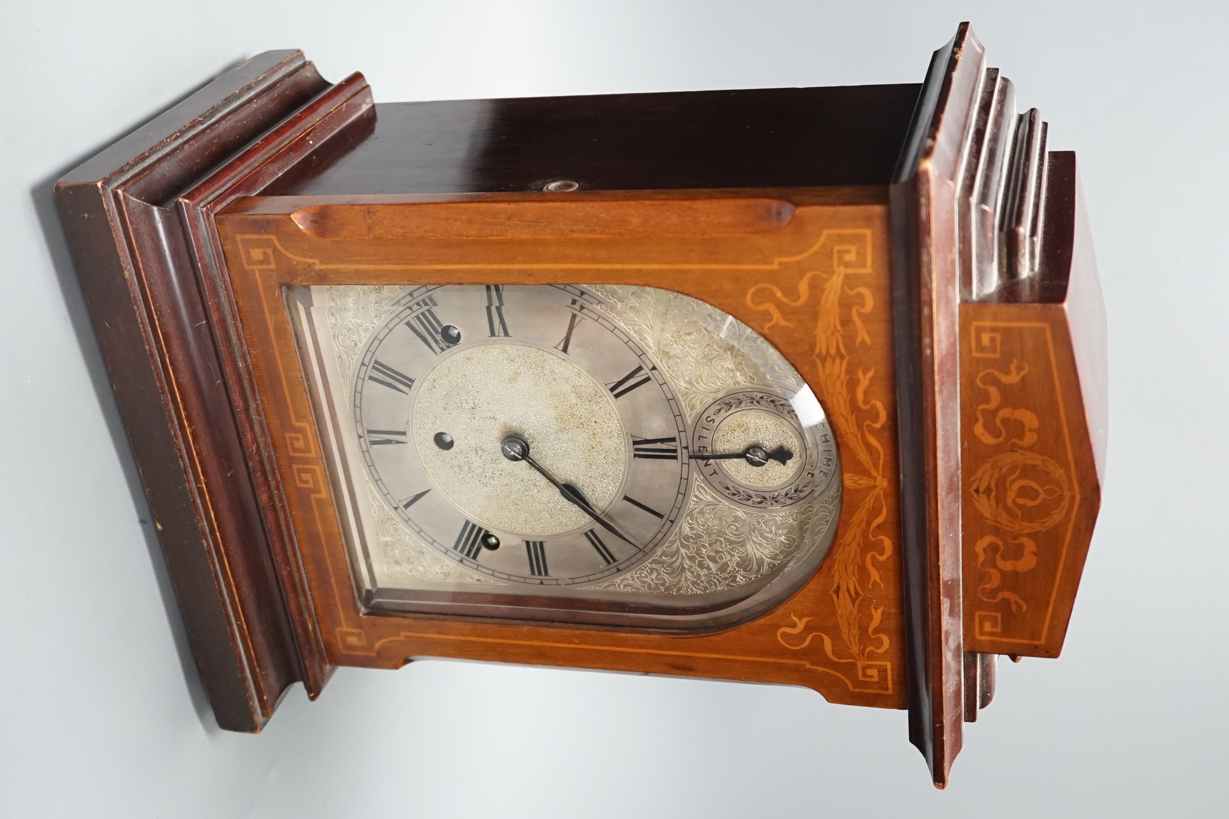 An early 20th century German walnut and marquetry chiming mantel clock, 42cms high